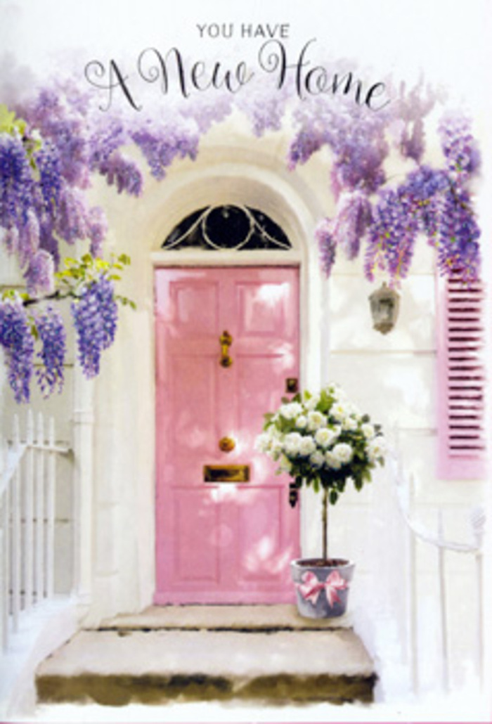 A tranquil Grove Park doorway is captured here as a poetic study in pastel tones and delicate florals, with a soft pink front door framed by generous drapes of lavender wisteria. The wisteria hangs in full spring abundance from above, its pendulous clusters of blooms forming a fragrant curtain that spills across the whitewashed wall and grazes a single matching shutter. The play of lavender, blush, and white creates a soothing palette, reminiscent of the calm, leafy avenues around Grove Park station where flowering gardens spill over front fences. On the stone step outside the door, a florist's metal bucket has been transformed into a welcoming housewarming arrangement. It is filled with plush white and cream roses, each bloom luxuriously full, the petals unfurling in soft layers that catch the ambient light. Tucked between the roses are sprigs of gentle green foliage, adding a whisper of texture and a sense of movement, as though the bouquet has just been gathered from a nearby garden. A satin ribbon in a warm pink shade is tied around the base of the bucket, its loose ends trailing slightly and echoing the colour of the door, tying every visual element together in a quiet chord of harmony. Sunlight filters through the wisteria leaves, scattering faint shadows across the threshold and metal pail, lending depth and softness to the composition. The mood is serene yet hopeful, like the stillness just before friends arrive with their first housewarming gifts. It feels like a personal, thoughtful floral gesture for someone starting a new chapter in Grove Park, where each petal and vine seems to murmur, You're welcome here; may this home be filled with light, love, and shared stories.