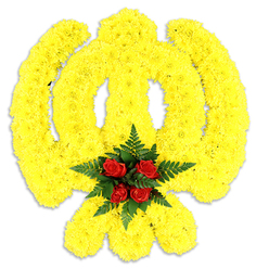 This image shows an expertly formed Khanda emblem crafted from a sea of bright yellow chrysanthemums, each small bloom arranged so densely that the sacred symbol reads with sculptural clarity: the central double-edged khanda blade, the circular chakkar, and the two crossed kirpans are all defined by the same sunlit yellow. The chrysanthemums' petals create a soft, cushiony surface that catches the light like woven threads of gold, lending the emblem a warm, quiet dignity. Anchoring the composition, five deep red roses form a tight, emotive cluster at the centre of the chakkar, their velvety blooms offering a visual and fragrant counterpoint. Around those roses, dark green fern foliage fans out, its fine texture and cool tone sharpening the contrast and giving the heart of the Khanda a framed sense of calm. The tribute sits on a crisp white background with a gentle shadow beneath, a subtle cue that this is a substantial, freestanding floral piece suitable for memorial services or religious observances. The scent is gentle: the chrysanthemums' fresh, slightly sweet note threaded with the timeless perfume of roses. As a florist serving Grove Park and the surrounding Lewisham neighbourhoods-near Grove Park station, Baring Road and Chinbrook Meadows-I often recommend this kind of symbolic, handcrafted tribute for Gurudwara ceremonies, commemorations, or community events where faith and respect are paramount. Prepared with care and available for local delivery, this arrangement balances traditional symbolism with meticulous floral craft.