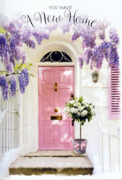 This image shows a charming Grove Park entrance transformed into a soft celebration of new beginnings, with a pale pink front door standing quietly at the centre of the scene. The door is framed above and to the side by abundant wisteria, its lavender flowers tumbling down in long, scented garlands that brush against whitewashed walls and a gently painted shutter. Each cluster of blossoms adds to the impression of a natural canopy, like the lush greenery that lines the paths down towards the river at Strand-on-the-Green, casting a dappled play of light and shadow across the façade. On the doorstep, the focus shifts to a thoughtfully arranged floral display: a simple metal bucket, cool grey in tone, filled to overflowing with creamy white roses. The roses are plump and generous, their petals layered and soft, with hints of ivory and buttercream that glow in the light. Sprigs of muted green foliage weave among the blooms, giving the arrangement a relaxed, garden-fresh feeling rather than something overly formal. Around the base of the bucket, a tender blush ribbon is tied in a neat bow, mirroring the pink of the door and unifying the entire scene with a gentle, romantic thread. The lighting is mellow and warm, as if captured in the late afternoon when the day is exhaling, and you can almost sense the quiet excitement of someone about to cross this threshold for the first time. It feels like an intimate, hand-tied message of congratulations, perfect for a housewarming gift delivered to a tucked-away terrace in Grove Park, bringing warmth and floral fragrance to an empty hallway that is about to become home.