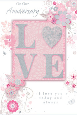 This elegant anniversary card carries the same gentle refinement you might sense when watching a carefully composed bouquet being finished at a neighbourhood shop near Grove Park. The design is anchored by a textured arrangement spelling out the word "LOVE," each letter raised from the surface and traced with fine, glittering edges that shimmer softly in the light. Behind and around this central motif lies a soothing palette of pearly whites, tender greys, and powder pinks, creating a subtle glow, as though the card has been lit from within. The background blush hue feels warm yet understated, like the soft sky over Grove Park just before sunset. Encircling the raised letters, a delicate spray of illustrated flowers and swirling vines arcs gracefully across the card. The blossoms, rendered with careful line work and gentle shading, evoke the artistry of a florist selecting and arranging romantic blooms for anniversary deliveries around Grove Park and nearby Chiswick. Tiny touches of silver foil glint on the petals and leaves, providing hints of sophistication without disturbing the card's calm mood. The floral elements seem to dance lightly, suggesting both celebration and tenderness. Scripted text-expressing heartfelt wishes for continued affection and shared memories-is set in an elegant, flowing hand that harmonises with the curves of the flowers and vines. There is a sense that this card is meant to be cherished and perhaps kept in a special drawer or memory box, much like a dried flower pressed between pages. Overall, the combination of raised glitter letters, soft colours, and intricate botanical detailing makes this anniversary card feel like a softly scented memory: enduring, carefully arranged, and resonant with love.