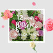 This image conveys a quiet yet joyful promise: a full year of roses delivered in a style that feels unmistakably rooted in Grove Park's gentle, riverside character. At the heart of the scene is a generous, domed bouquet of roses in a wide spectrum of soft shades, from delicate blush and creamy ivory to dusky lilac and vibrant magenta. Each bloom is unique; some open wide to reveal complex spirals of petals, others stay cupped and rounded, suggesting the anticipation that comes with each new monthly delivery. The roses are supported by fresh green foliage, with leaves that vary subtly in size and shape, giving a sense of natural movement, as if the flowers were just gathered from a well-tended garden. The composition rests against a pale, neutral background reminiscent of sunlit walls in a local Chiswick or Grove Park townhouse. Scattered around the central cluster, loose petals and a few small blooms appear to float, adding a touch of whimsy and evoking the feeling of rose fragrance gradually drifting through a room. The overall atmosphere is elegant but unforced-perfect for long-term gifting between family members, partners, or close friends who live near the Thames Path or off Fauconberg Road and wish to share something that lasts beyond a single occasion. You can almost feel the cool silkiness of the petals, hear the faint rustle as the bouquet is unwrapped, and sense the gentle, uplifting scent that would mark the arrival of each fresh arrangement over the course of the year.