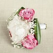 Exuding an air of fresh romance inspired by the leafy serenity of Grove Park, this compact bouquet showcases the expertise of local floral hands. Three striking pink roses, their petals unfurling in a beautiful spiral, glow with shades of vivid magenta, blush, and the softest hints of lavender-each symbolising a loving connection or joyful new beginning. Tucked between the roses, a generously ruffled white peony adds depth and lush texture, its pristine petals billowing like a gentle cloud over a quiet park morning. Fine sprays of baby's breath dance amid the roses and peony, their miniature white blooms casting a misty, softening veil over the arrangement and evoking the lightness of spring breezes along Grove Park's garden paths. Deep green leaves, neatly folded and full of sheen, wrap the base and provide contrast, while a white satin ribbon binds the stems in a smooth, finished handle-inviting anticipation for the moment it will be carried. With gentle, balanced lighting enhancing the natural beauty and artistry, this bouquet is a celebration of local Grove Park style: elegant, fresh, and perfect for bridal parties or a heartfelt gift delivered to a loved one across the neighbourhood's quiet avenues.