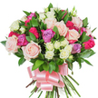 A densely gathered, hand-tied bouquet of mixed roses sits against a clean white background, its composition radiating soft romance and joyful celebration. Large, classic rose heads open fully in gentle pastel pink and creamy white, their layered petals showing subtle veining and satiny texture; among them, brighter fuchsia roses push forward with energetic colour, while a few pale lavender roses lend cool, floral notes to the palette. Sprays of tiny white spray roses, some with the faintest buttery-yellow centers, are tucked into the mass of blooms to add delicate points of light and intricate scale contrast. Dark green, glossy leaves-likely salal or ruscus-are artfully woven between the roses, their spear-shaped, resilient forms providing a lush, structured backdrop and a pleasant rustle when handled. At the base the long stems are neatly gathered and wrapped, finished with a wide baby-pink satin ribbon tied into a generous, elegant bow whose smooth sheen catches the studio light and echoes the bouquet's soft colour story. The overall effect is compact and sumptuous, photographed in soft, even light that highlights petal texture and the freshness of cut stems. This arrangement reads as both celebratory and tender, perfect for occasions where heartfelt appreciation or romantic warmth is intended - birthdays, anniversaries, Mother's Day, or a quiet floral surprise for someone in Grove Park or nearby Hither Green. A florist's craft is visible in the balance of scale, the contrast between full roses and tiny sprays, and the careful placement of foliage, creating a bouquet that looks as good felt as it does seen: plush, fragrant, and undeniably thoughtful.