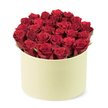 Soft, luxurious, and evocative, a lush red rose box sits in its pale cream hatbox, the two dozen or more roses forming a dense, rounded crown that rises just beyond the rim. Each bloom is velvety, with petals curled to perfection, set against hints of dark green foliage that peek between the heads. The container's smooth matte surface in ivory or pale cream frames the bouquet with quiet sophistication, while the clean white background isolates it as a premium gift. A slightly elevated, three-quarter view gives the arrangement a sense of presence, as if ready to be handed over with a gentle, respectful smile. 

In Grove Park, this bouquet signals romance, thoughtful anniversaries, or a luxurious Valentine's surprise. Availability for same-day delivery across the area ensures the moment can be seized today, bringing a touch of high-end floral artistry to doorsteps, cafes, or living rooms. 

The design speaks of careful hand-picking, meticulous trimming, and thoughtful staging, a testament to the skill of a local florist who treats every bloom as a memory in the making, while the box's soft ivory finish keeps the focus on the lush red petals and their quiet magnetism.
