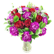 A lush, rounded bouquet of deep red roses and vivid magenta-purple carnations sits in a simple clear glass vase against a pure white backdrop, described here as if whispering its colours and textures to you. The roses range from tight, velvet-edged buds to blossoms just beginning to unfurl, their spiraled petals catching soft light and suggesting a classic, intimate romance. Interspersed among them, the carnations offer dense, ruffled layers - almost feathered in appearance - their saturated purple tones leaning toward fuchsia and creating a lively contrast with the roses. Glossy emerald leaves, likely ruscus or similar, form a shining, supportive base while slim, silvery eucalyptus sprigs lift the composition with a modern, aromatic breath; the leaves' matte sheen and the stems' visible crisscross through the vase give the arrangement a grounded, fresh honesty. The composition is full and generous, arranged to read as a single, abundant cluster that would feel comforting on a dining table or striking on a mantel. In gentle morning or studio light the petals take on a soft glow and the bouquet projects a celebratory yet refined mood - ideal for anniversaries, heartfelt congratulations or to brighten a home after a day at work. As a local florist would note, this arrangement reflects careful placement and a sensitive eye for balance and scent; in Grove Park it would travel well to nearby streets and green corners, offering a fragrant, tactile gift that reads as both thoughtful and elegantly assured.