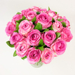 A generous, hand-gathered bouquet of about two dozen pink roses sits in a clear glass vase, the blooms forming a dense, rounded dome that feels both celebratory and intimate. Each rose is fully or nearly fully open, layers of velvety petals unfurling from tight, deeper hearts of rich fuchsia to outer edges washed in soft blush and pale rose, creating a subtle, natural ombré that draws the eye inward. Dark, glossy green leaves are tucked between the heads, their cool tones grounding the warm pinks and adding texture that makes the arrangement read as freshly cut from a garden. The photograph catches the bouquet from a slightly elevated, overhead angle beneath even, daylight-balanced lighting, so the petals' texture and the slight sheen on the glass vase are gently revealed against a bright white background. As a florist describing this to a client, I'd note the tactile contrast between the petals' velvety softness and the smooth, clean rim of the vase, and the faint, powdery rose scent that seems to float up when you lean in. The overall feeling is one of classic romance and heartfelt celebration - equally suited to an anniversary, Mother's Day, or a thoughtful gift to brighten a home. Local clients in Grove Park and nearby neighbourhoods will recognise the seasonal freshness we source from local markets; the composition suggests care, abundance, and approachable elegance without fuss, offering a floral moment that reads as both timeless and quietly joyful in any room it graces.
