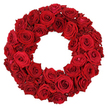 A lush, circular wreath crafted entirely from dozens of deep crimson roses, densely packed against a clean white background. The arrangement creates a plush texture where large, fully opened blossoms meet smaller, partially opened blooms, all forming a continuous ring with a clear hollow center. The petals' velvet surfaces catch the light along their edges, and the uniform ruby-red tone lends a striking, elegant silhouette that commands attention without any greenery or filler. This image, timeless in its symbolism of remembrance, tribute, and profound love, lends itself to articles about memorial services, anniversaries, or formal decorations. In Grove Park, such a rose-rich wreath is a versatile choice for families and events alike, available for same-day delivery across the area to ensure freshness at the moment of need. Crafted by Grove Park Florist, it stands as a dignified statement for chapels, memorial halls, or a refined home setting where memory meets beauty.