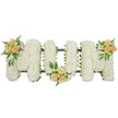 A tasteful memorial flower tribute spells the word MOM in three large, upright letters, displayed against a bright white background that draws attention to the detail of every bloom. Each letter is filled edge to edge with tightly clustered white spray chrysanthemums, their petite, multi-petalled faces forming a dense, cushioned surface. The uniform whiteness of the flowers suggests purity, remembrance, and a gentle kind of peace. Around the edges, a slender trace of dark green ribbon and structural foliage subtly outlines the shapes, hinting at the sturdy frame supporting the design and offering a quiet contrast to the pale petals. Three small, carefully composed clusters of roses bring warmth and softness to the piece. In each cluster, soft peach and apricot roses, some opening into full, spiralled blooms and others still in neat buds, are nestled into the chrysanthemums. One is placed on the upper left curve of the first M, the second rests at the lower centre of the O, and the third adorns the upper right curve of the final M. Airy fern fronds and glossy green leaves extend gently from these rose groupings, adding texture, depth, and a sense of freshly gathered garden foliage. The overall effect is one of understated elegance and heartfelt sentiment, ideal as a central tribute for a mother's funeral or celebration of life. This style of design would be well suited to a service in Grove Park, perhaps near Baring Road or by the open spaces around Chinbrook Meadows, where its calm white chrysanthemums and soft peach roses can speak quietly of love, loss, and cherished memories.