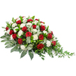 The photograph shows a dignified sympathy spray lying horizontally on a bright white background, its structure carefully shaped to be more abundant on the left and gradually taper into a delicate, trailing finish on the right. The floral heart of the arrangement is made up of deep red roses and pristine white carnations. The roses, with their richly coloured, velvety petals, sit like beacons of devotion and deep affection throughout the design. The carnations, by contrast, are soft and slightly frilled, their pure white petals forming pillowy clusters that add lightness and a sense of calm to the composition. The flowers are supported by an intricate layer of greenery that gives the piece both structure and depth. Dark green leaves form a strong, solid base, their broad surfaces catching the light with a gentle sheen. Interlaced among them are cooler, silvery-green eucalyptus leaves that bring a more muted tone, softening the palette and enhancing the feeling of gentle remembrance. From the right-hand tip, fine, trailing strands of lighter greenery extend outward, adding a final flourish of natural movement, as if gently drifting in a quiet breeze somewhere near Grove Park's tree-lined avenues. The overall impression is one of respectful grace and heartfelt condolence, perfectly suited for a funeral, wake, or memorial service. It is easy to imagine this arrangement crafted by Grove Park Florist and delivered to a local church or crematorium, where it would bring a composed, comforting presence as friends and family gather to honour a life well lived.