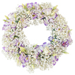 A softly luminous funeral wreath fills the frame, displayed against a bright white background that throws all attention onto its refined floral workmanship. The structure is a perfect circle, entirely clad in tiny white baby's breath blossoms that cluster together like a ring of delicate clouds. This sea of Gypsophila creates an airy, almost lace-like texture, as if the wreath has been woven from mist or fine fabric. Resting upon this gentle base are striking lisianthus blooms, whose petals are gracefully ruffled and layered. Each lisianthus is primarily white, yet the petal edges carry a wash of lilac and purple, sometimes in a narrow band, sometimes in a more diffused halo of colour that softens toward the centre. A mix of fully open blooms and smaller buds-shaded in pale green with hints of creamy yellow-gives the arrangement an organic, evolving feel, suggesting both remembrance and quiet renewal. The inner hole of the wreath remains empty, forming a tranquil circle of space that strengthens the symbolic sense of eternity and unbroken connection. No foliage or additional flowers interrupt the understated palette, so the contrast between the snowy Gypsophila and the purple-edged lisianthus reads as calm, respectful, and pure. The lighting is even and gentle, evoking the still atmosphere of a reflection-filled service at a chapel near Grove Park. This thoughtful design would sit beautifully beside a coffin, at a memorial, or on a graveside, expressing love, peace, and heartfelt condolences in a soft and dignified way.