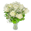 A graceful bouquet of about a dozen pristine white roses sits in a simple clear glass vase, photographed against a bright white backdrop that makes every petal and stem read with crystalline clarity. Each rose carries soft, creamy white petals that unfurl in stages-some fully open with layered, velvety curves, others still coyly unfolding-so the eye travels in gentle waves across the arrangement. Sprays of tiny white baby's breath (Gypsophila) float like spun cloud between the larger blooms, lending an airy, lace-like texture that softens edges and gives the composition an almost luminous halo. The foliage is rich and varied, from deep emerald leaves that anchor the bouquet to lighter, fresher greens that peek through and add a crisp, verdant contrast; the glossy surfaces catch the light, revealing vein and satin texture. The clear vase exposes neatly trimmed stems and a visible waterline, a small, honest detail that signals freshness and careful handling. Bathed in soft, diffused daylight, the arrangement reads as calm and composed-a floral expression suited to weddings, quiet celebrations, or moments of remembrance. The scent here is suggested rather than overpowering: a tender, green whisper that evokes early-morning gardens and conservatory windows. As a local florist arranging similar bouquets for people around Grove Park and the nearby Chinbrook Meadows, I think of how these whites bring serene brightness into living rooms and ceremony spaces alike; they are a quiet, tasteful statement of affection, sympathy, and enduring elegance crafted with attentive hands.