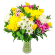 In this photograph, a joyful mixed bouquet sits proudly in a clear glass vase, set before a clean white background that allows its vivid colours and varied textures to take centre stage, much like a standout arrangement in a Grove Park shop window. The design is densely rounded and full, featuring an abundance of bright yellow roses and large yellow chrysanthemums that create a warm, sunlit core. Their tightly layered, ruffled petals add generous texture and a sense of overflowing abundance. Around these focal blooms, crisp white chrysanthemums and daisy-like flowers with lime-green centres are scattered, their slender white petals introducing freshness and an easy, breezy feel. Vivid magenta and fuchsia chrysanthemums pop up throughout the bouquet like little fireworks, while softer pastel pink blossoms nestle in between, subtly enriching the overall colour story. Encircling the flowers is a bed of deep green foliage with smooth, glossy, oval leaves, adding structure and a lush, natural frame that echoes the greenery found along nearby riverside walks. The stems are clearly visible through the transparent vase, resting in clear water, giving an honest, uncluttered look that suits a modern Grove Park home. The emotional tone of the bouquet is light, happy, and encouraging-perfect for sending a spontaneous thinking of you, celebrating a birthday, or brightening a living room or office in Grove Park and neighbouring Chiswick. Its combination of sunny yellows, calming whites, and playful pinks creates an inviting, positive presence, as if the flowers themselves are quietly offering a smile.