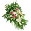 This heartfelt funeral spray, assembled by local Grove Park florists, is a gentle mosaic of nature's finest elements, sophisticated yet comforting in its design. Creamy white lilies form the arrangement's tranquil focal point, their petals unfolding in the soft cascade that moves from the top left to the bottom right, reminiscent of gentle paths along Grove Park's leafy walks. Surrounding these are the soft blush and vibrant fuchsia pink of roses-some tightly furled, others fully blossomed-evoking memories, warmth, and compassion. Sprays of ruffled white carnations add fullness and bring a note of serenity, while clusters of crisp, moss-like green button chrysanthemums introduce playful texture and hints of renewal. Lively red hypericum berries sparkle among the ensemble, beautifully set against a dense backdrop of varied, glossy foliage, from grand structured leaves to slender palm fronds drifting downward. Softly illuminated, every detail is designed for comfort and peace, providing solace to Grove Park families in moments of farewell. Perfect for funerals, memorial gatherings, or as a tribute of sympathy, this spray offers a quiet gesture of remembrance rooted in local empathy and expertise.