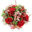 The image shows a lavish, dome-shaped bouquet photographed from above, its colours heightened by the stark white background beneath. At its heart, luxurious deep crimson roses open fully, each velvety petal curling outward in layered spirals that suggest enduring love and intimacy. Between these showpiece roses, clusters of pale pink waxflower emerge, their tiny star-like blossoms and subtle yellow centres adding detail and a gentle contrast that lightens the deep reds. The entire bouquet is wrapped in a blanket of fresh green foliage, from wide, solid leaves that provide structure to more delicate, arching stems that add a natural, garden-like movement, reminiscent of greenery seen on walks around Grove Park's leafy streets. Threaded among the foliage are distinctive bronzed and burgundy leaves, some highlighted with reddish-brown veins, which introduce a sophisticated, almost autumnal mood and give the bouquet a nuanced play of light and shadow. Dotted throughout are smaller, darker red flowers-probably alstroemeria or another bell-shaped bloom-whose slightly deeper tones enhance the crimson palette and bring further texture. The arrangement is densely packed and carefully balanced, creating a generous, full-bodied dome that feels both luxurious and intimate, suitable for resting at the centre of a dining table or being held close in two hands. A hint of red and white patterned tag or ribbon peeks discreetly from the lower edge, suggesting a completed gift, ready for same-day delivery by Grove Park Florist to nearby homes, cafés, or riverside apartments. The bouquet overall conveys passion, celebration, and thoughtful appreciation, perfect for anniversaries, romantic evenings, or special occasions shared within the Grove Park community.