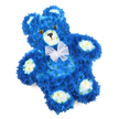 A three-dimensional teddy bear crafted entirely from fresh flowers is photographed against a pure white background, creating a striking yet gentle tribute. The bear is predominantly royal blue, its body composed of hundreds of tiny, tightly packed blossoms that mimic the look and feel of plush fur. Each petal adds to a sense of depth and softness, from the rounded head and plump body to the outstretched arms and legs. Contrasting clusters of creamy white to soft yellow flowers shape the bear's muzzle, the inner circles of its ears, and four oval paw pads, providing a tender highlight that softens the rich blue and draws attention to its sweetest features. The bear's face is calm and kind: two large, glossy dark brown eyes with black centres seem to gaze gently outward, while a small black triangular nose and a fine curved line beneath create the impression of a quiet, reassuring smile. Around the neck, a translucent white organza-style bow is tied into a neat, full bow, its sheer loops and tails resting lightly against the flowers and adding a touch of innocence and elegance. The arrangement is designed to lie flat but is photographed at a slight angle, giving a sense of dimension and presence without disturbing its stillness. As a local Grove Park florist, I imagine this blue floral teddy being carried carefully into a chapel near Marvels Lane or delivered to a family home overlooking Grove Park's tree-lined streets, chosen for a baby boy's funeral, a child's memorial, or a special remembrance tribute, where its soft colours and tender expression offer a final symbolic cuddle made from living blooms.