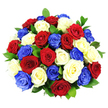 A vivid bouquet of roses in red, white, and cobalt blue is shown in a perfectly rounded, hand-tied style, the blooms gathered so tightly that they form a seamless dome of colour and texture. About three dozen roses are arranged under bright, even lighting that highlights the velvety surfaces of their petals and the gentle shadows within each layered spiral. The red roses appear rich and dramatic, the white blooms offer a cool, luminous contrast, and the blue roses stand out as bold, contemporary accents, giving the arrangement a distinctly patriotic character that would suit commemorative events and celebrations around Grove Park. Dark green foliage is threaded between the blossoms, visible in small pockets that frame and separate the flowers, preventing the colours from merging into one mass and adding a natural depth that softens the strong palette. The background is plain white, allowing the bouquet to take full visual focus, as though it were placed on a spotless table in a Grove Park townhouse or community hall ready to welcome guests. No stems or container are visible, so the viewer experiences the flowers as a single, unified form rather than as individual stems, emphasizing the arrangement's message of togetherness and shared pride. The overall atmosphere is one of respect, joy, and quiet strength-a floral design that would feel at home at a military homecoming, a national holiday gathering, or a family celebration where honouring tradition and expressing heartfelt emotion matter just as much as beauty.