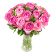 A lovingly gathered dome of nearly two dozen pink garden roses sits in a clear glass vase, each bloom layered with satiny petals that move from a deep fuchsia heart to a softer blush and occasionally a creamy white rim. The roses are closely packed to form a plush, rounded silhouette, the rich green leaves tucked in between and beneath the cups of flowers providing cool contrast and natural texture. Through the transparent vase you can see the neatly trimmed stems clustered in clear water, lending a sense of freshness and honest craftsmanship. Bright, even studio lighting picks out the subtle creases and spiral centers of each bloom, and I imagine the gentle, fruity perfume typical of freshly cut roses hovering just above the heads, an invitation to draw near and breathe in their summer warmth. The overall feeling is classic and generous-perfect for an anniversary, Mother's Day, or to celebrate a meaningful milestone with timeless romance. As a florist from Grove Park who arranges flowers daily for neighbours around Grove Park station and the high street by Baring Road, I choose this restrained white backdrop so the pink gradations read like a single, soothing chord: vibrant at the core, tender at the edges. This image is as much about the tactile luxury of petals and the clean geometry of a glass vase as it is about the quiet confidence of a bouquet made to comfort, delight, and mark an occasion with simple, unshowy elegance.
