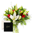 From Grove Park Florist, this elegant bouquet unfolds like a morning garden distilled into a single vase, a vivid homage to landscapes just beyond the High Street. The white lilies sit at the heart, their trumpet shapes and creamy satin petals catching the light with a soft, almost reverent radiance. They are flanked by dense, emerald green foliage-long spears and curling fronds-that weave around the blossoms, lending the arrangement a sculptural grace. The red roses punctuate the composition with a passionate clarity, their velvet blooms glowing against the cool white and green, a steadfast statement of admiration and warmth. A touch of eucalyptus or cool-toned greens adds movement, a breeze through a grove, while unopened lily buds hint at promises yet to bloom. The bouquet rests in a clear glass vase, with glossy leaves cradling each stem and catching the day's light as if to spotlight the craft of the florist.

In this soft, natural light, the contrasts feel bold but refined, like a tribute to someone who embodies both courage and tenderness. Wrapped with a message of appreciation and heroism, the bouquet feels like Grove Park Florist's personal note; 'You are extraordinary; you are valued' - a perfect gesture for any moment calling for heartfelt acknowledgment. Available for same-day delivery across Grove Park, Crofton Park, and Lewisham, this arrangement also makes a thoughtful thank-you or remembrance gift for someone whose spirit inspires.